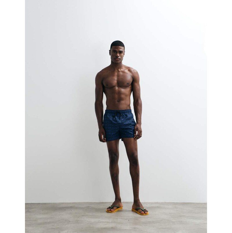 HUGO Red all over printed logo swim shorts in blue