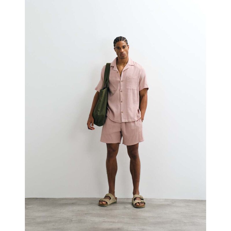 ASOS DESIGN co-ord crinkle texture shorts in mid length in pink