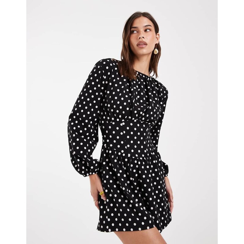 ASOS DESIGN polka dot cinched waist playsuit in black and white