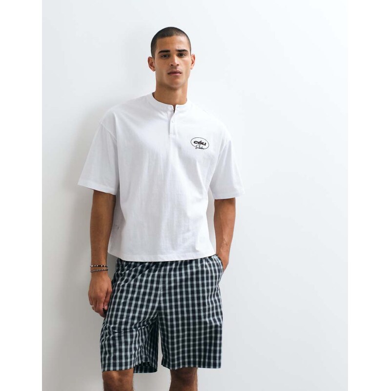 ASOS DESIGN boxy oversized henley t-shirt with chest graphic in