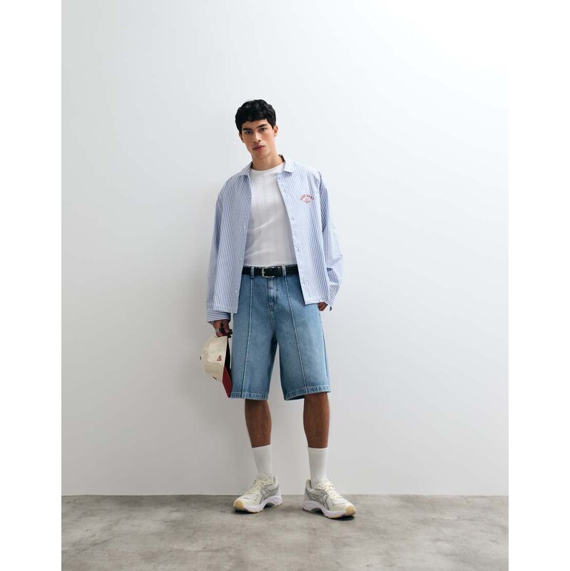 ASOS DESIGN loose longer length jorts in mid wash blue with