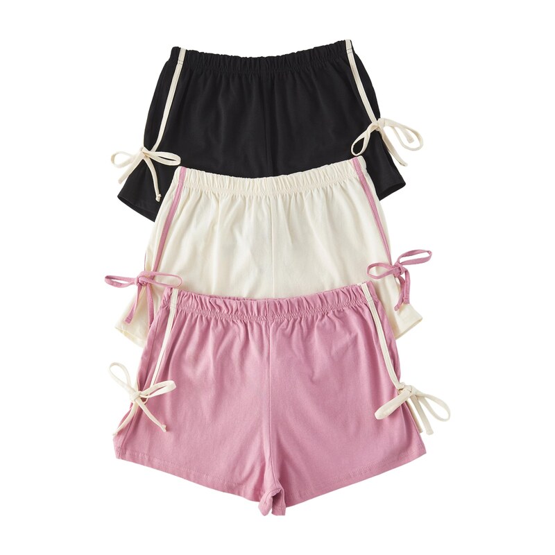 Trendyol Pyžamové kalhoty pink / černá / bílá