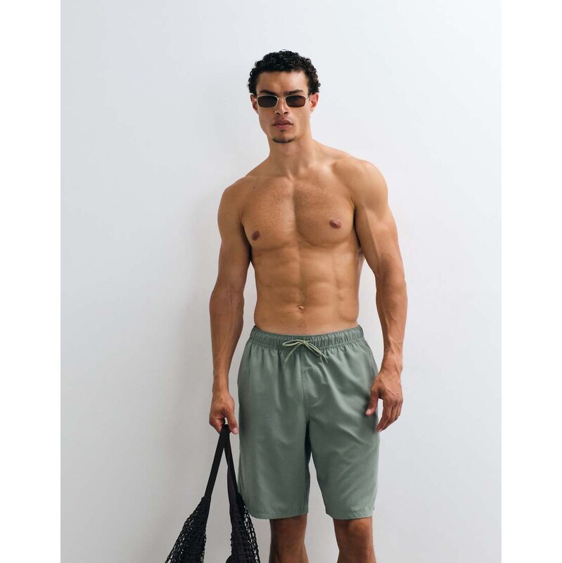 ASOS DESIGN swim shorts in long length in green
