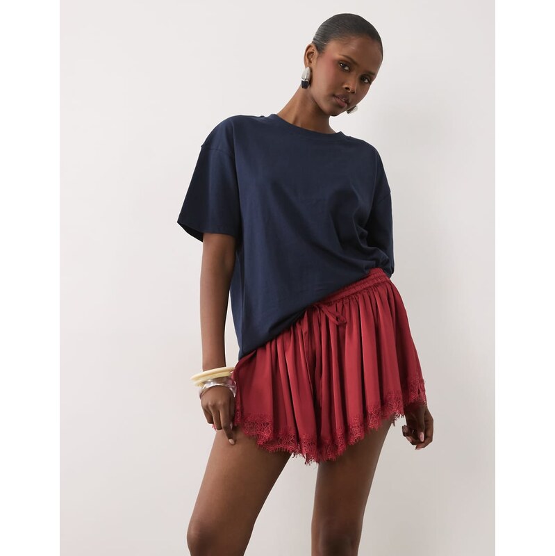 ASOS DESIGN lace trim volume satin shorts in red-White