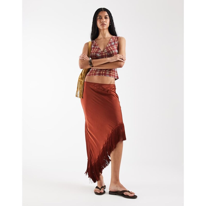 Reclaimed Vintage asymmetric hem midi skirt with tassels in rust