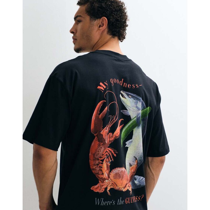 ASOS DESIGN oversized tee with Guinness print in Black