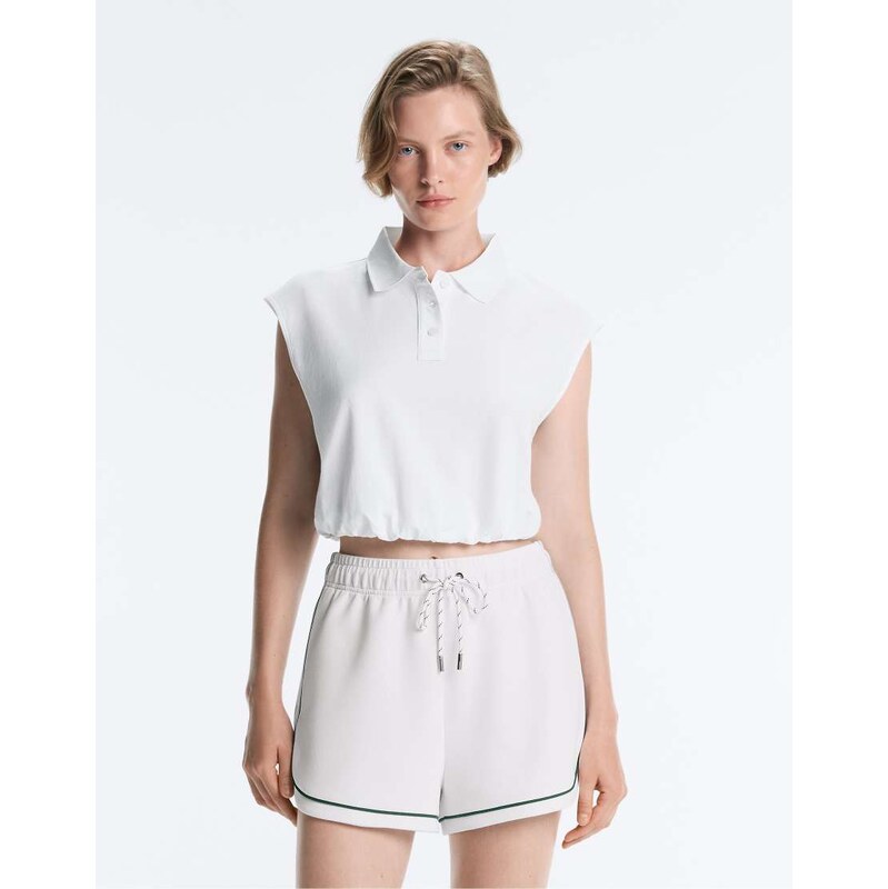 OYSHO Sleeveless piqué cotton polo shirt in off-white