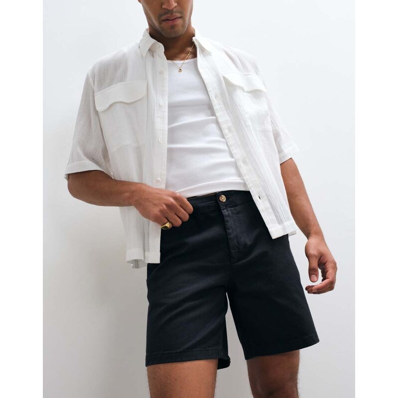 ASOS DESIGN slim fit chino shorts in mid length in black