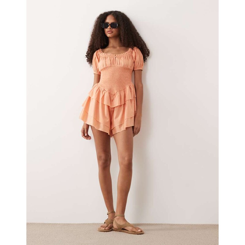 ASOS DESIGN shirred playsuit with ruffle shorts in coral-Orange