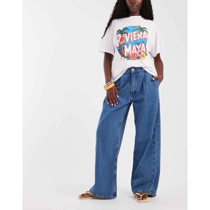 ASOS DESIGN pleat front horseshoe jean in midwash blue