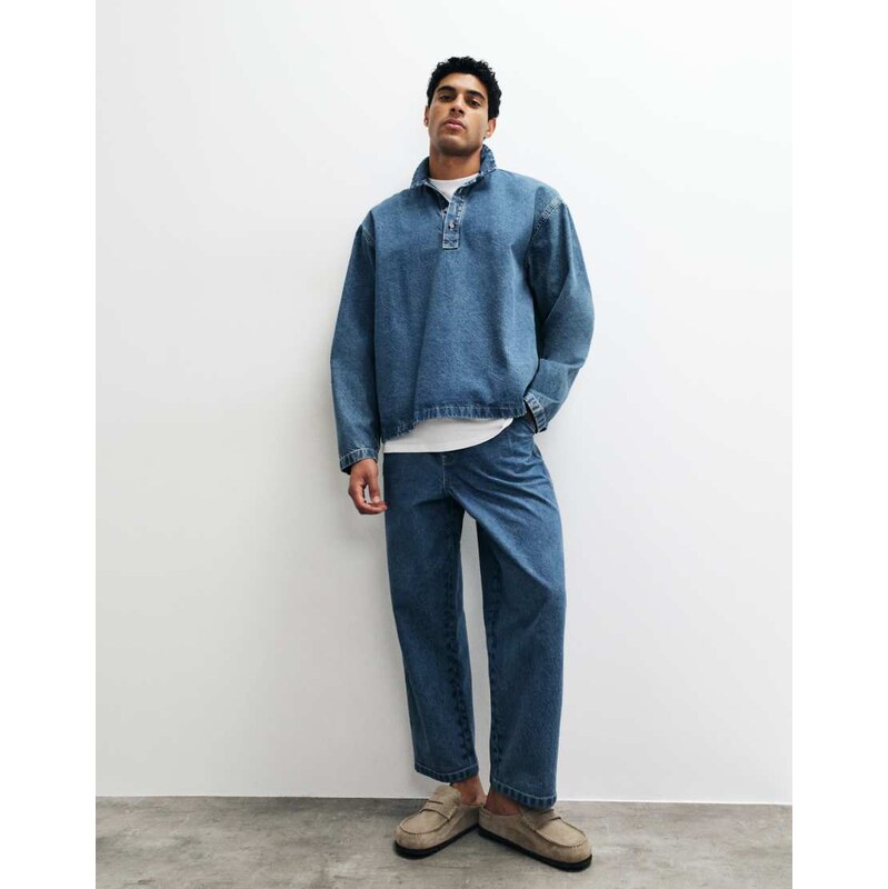 ASOS DESIGN relaxed tapered jeans in mid wash blue with pleats
