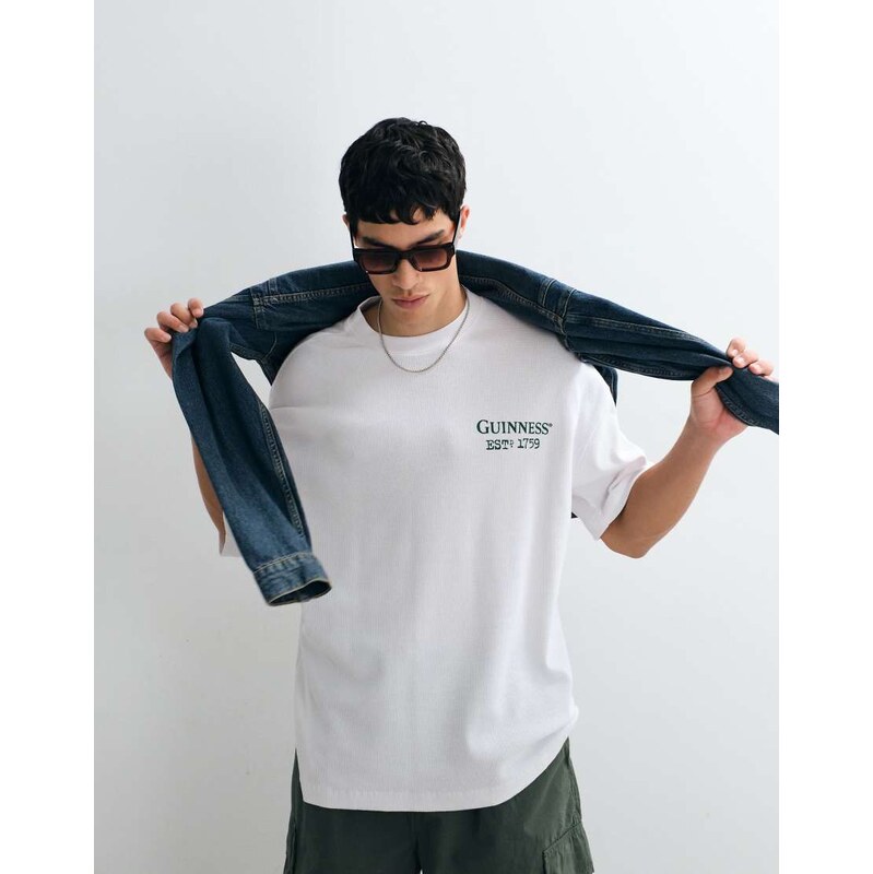 ASOS DESIGN Oversized t-shirt with Guinness print in Black