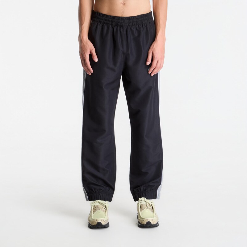 Kalhoty New Balance Trackside Woven Pant Black/ Slate Grey M