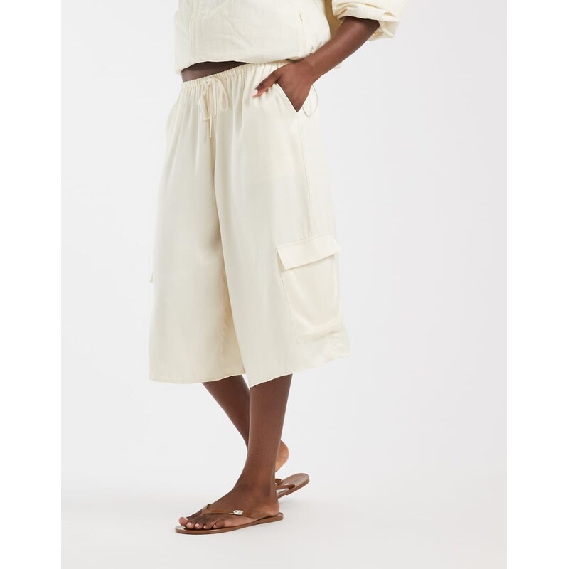 ASOS DESIGN satin bermuda cargo shorts in ecru-White