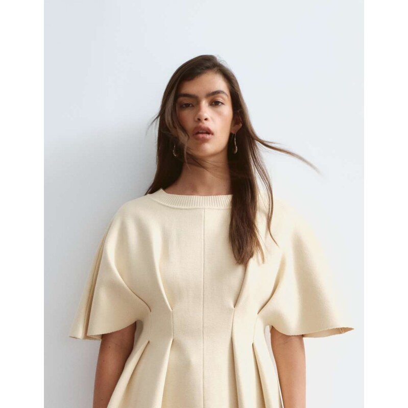 ARRANGE knit short sleeve cinched pleated top in buttermilk