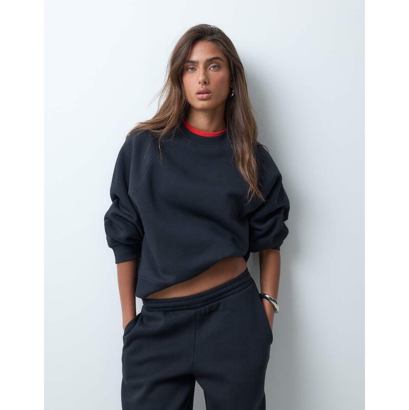 ASOS DESIGN Regular raglan brushback sweat in black