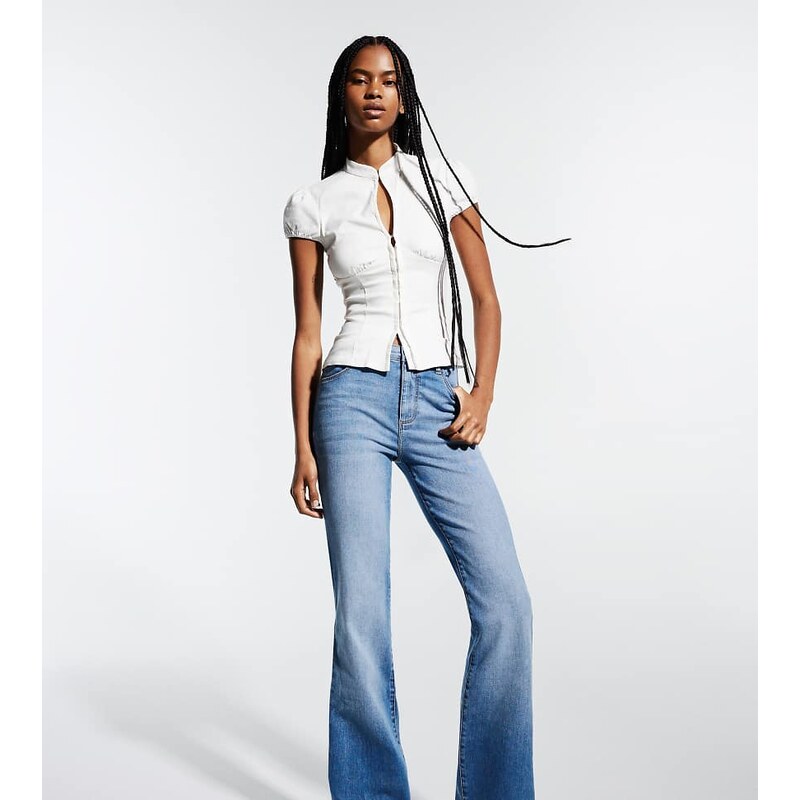 Bershka Tall flared jeans in mid blue