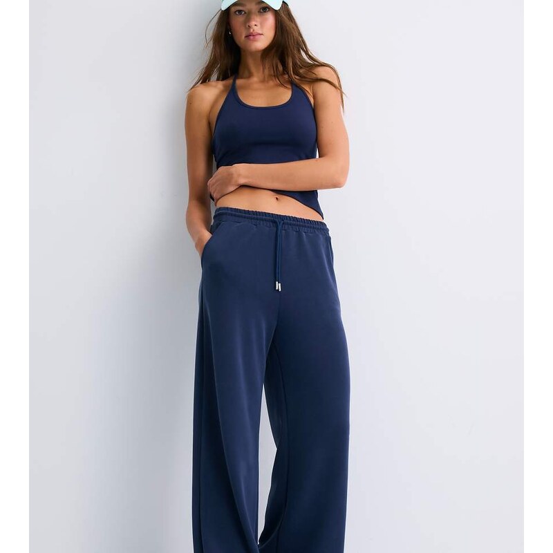 Stradivarius Tall soft-touch palazzo trousers in dark blue-Navy