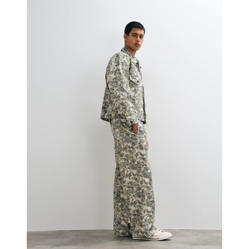 Prohibited loose fit pleat front camo jeans co-ord in multi