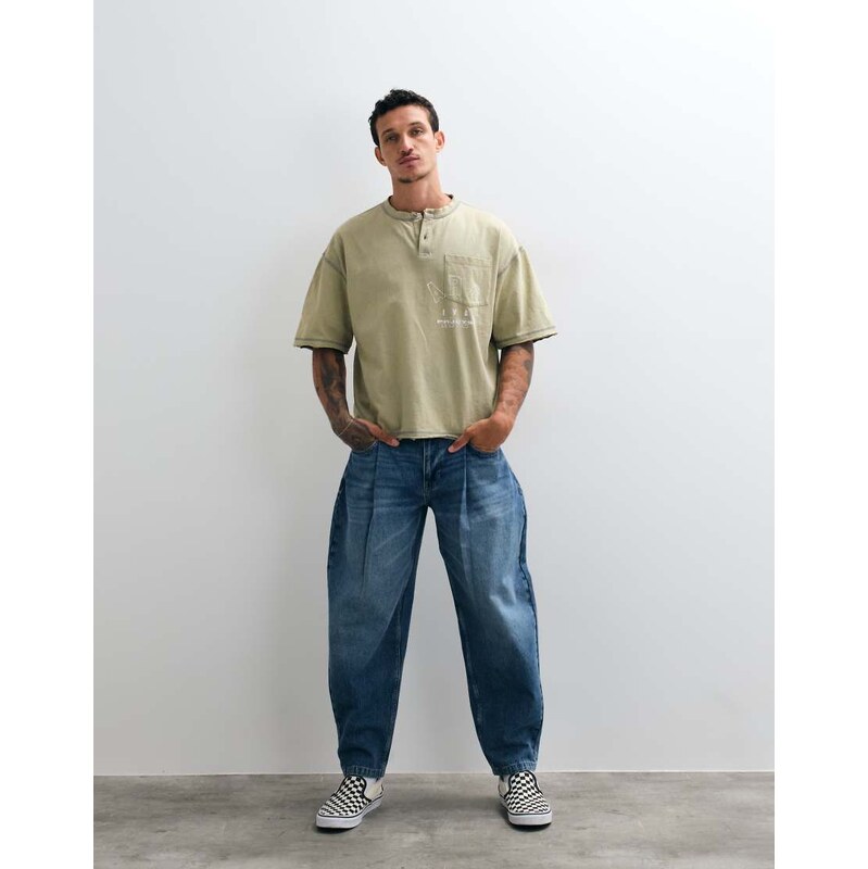 ASOS DESIGN relaxed barrel jean with pleats in mid wash blue