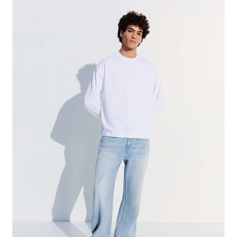 Bershka Tall straight flared jeans in mid blue