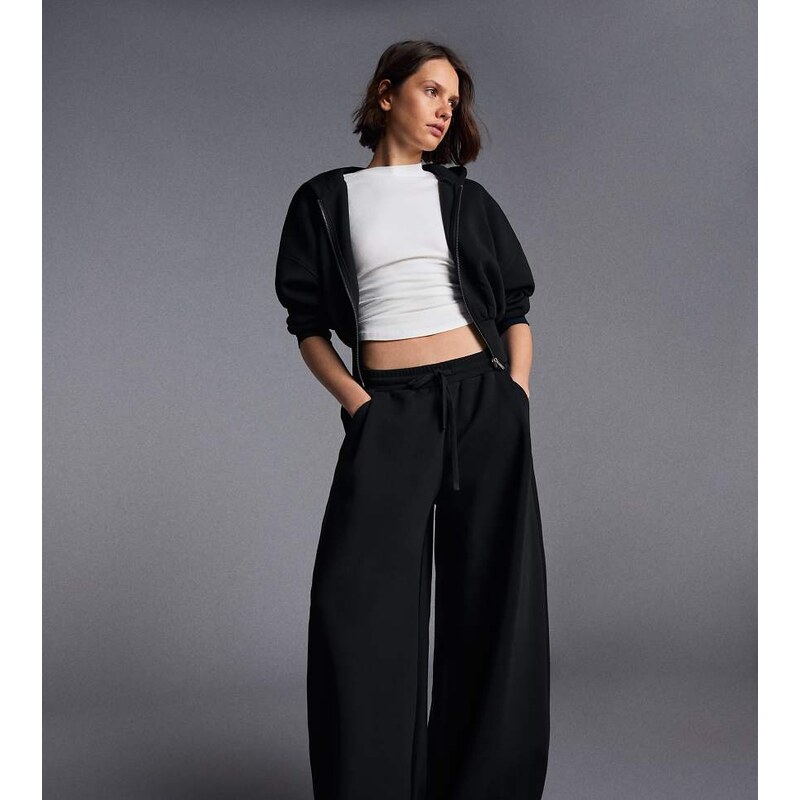 Bershka Petite modal barrel trousers in black