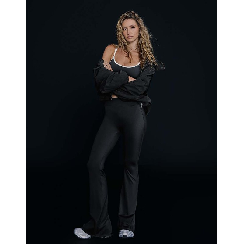 Bershka Flared technical fabric trousers in black