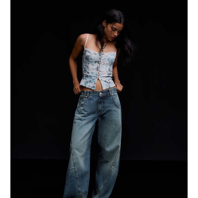 Bershka Petite low-rise barrel jeans in denim blue