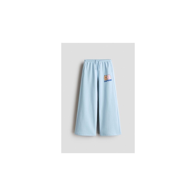 H&M - Kalhoty joggers tištěným motivem - Bleděmodrá/Capyfun