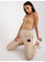Fashionhunters Béžové kalhoty z ekokůže s kapsami Lana
