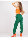 Fashionhunters Tmavě zelené tepláky Julia s kapsami