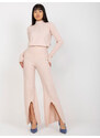 Fashionhunters Světle růžové široké úpletové kalhoty s rozparkem