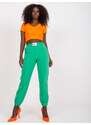 Fashionhunters Tmavě zelené dámské kalhoty z látky s mačkanou