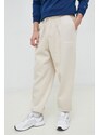 Tepláky Calvin Klein Jeans béžová barva, s aplikací
