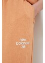 Tepláky New Balance oranžová barva, s potiskem, WP31508SEI-SEI