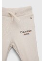 Kojenecké tepláky Calvin Klein Jeans béžová barva