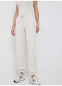 Tepláky Calvin Klein Jeans dámské, béžová barva, s aplikací