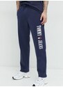Bavlněné tepláky Tommy Jeans tmavomodrá barva, s aplikací