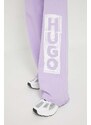 Bavlněné kalhoty HUGO fialová barva, s potiskem