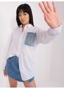 Fashionhunters Bílá dámská oversize košile s nášivkami