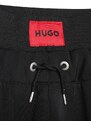 Dětské tepláky HUGO černá barva, s aplikací