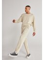 AC&Co / Altınyıldız Classics Unisex Beige Standard Fit Normal Cut, Flexible Cotton Sweatpants with Pockets.