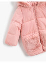Koton Long puffer jacket with plush detail and pockets.