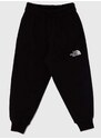 Dětské bavlněné tepláky The North Face OVERSIZED JOGGERS černá barva