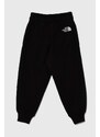 Dětské bavlněné tepláky The North Face OVERSIZED JOGGERS černá barva