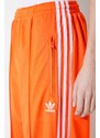 Tepláky adidas Originals oranžová barva, s aplikací, IP0640